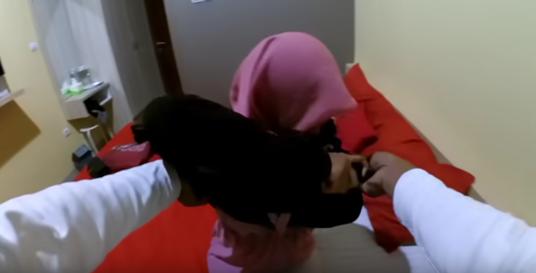 Ferani Dhita about: a Hijaber girl serve in a hotel room